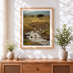 Finished herd of lions crossing a river cross stitch artwork displayed