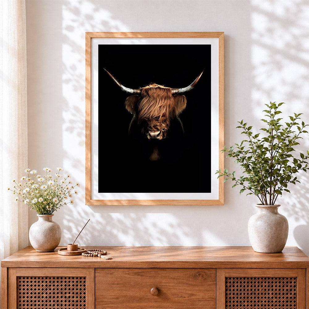 Finished highland cow on black background cross stitch artwork displayed