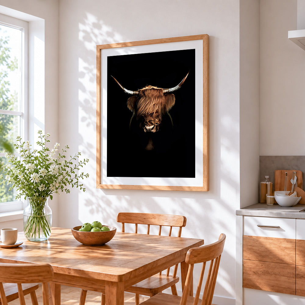 Highland cow on black background cross stitch artwork displayed on wall as home decor
