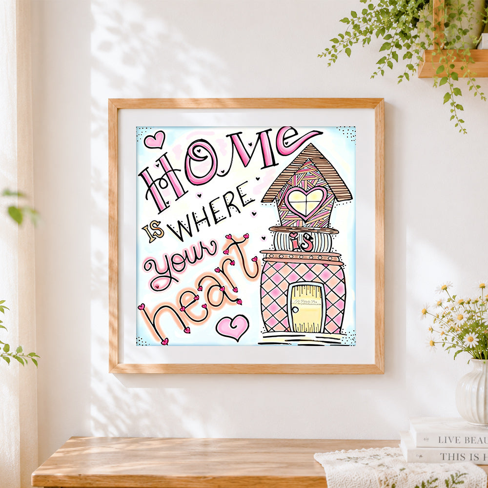 Finished home is where your heart is cross stitch artwork displayed