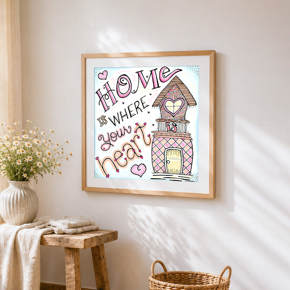 Home is where your heart is cross stitch artwork displayed on wall as home decor
