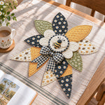 Honey bee handmade quilted bow displayed on a table as seasonal home decor