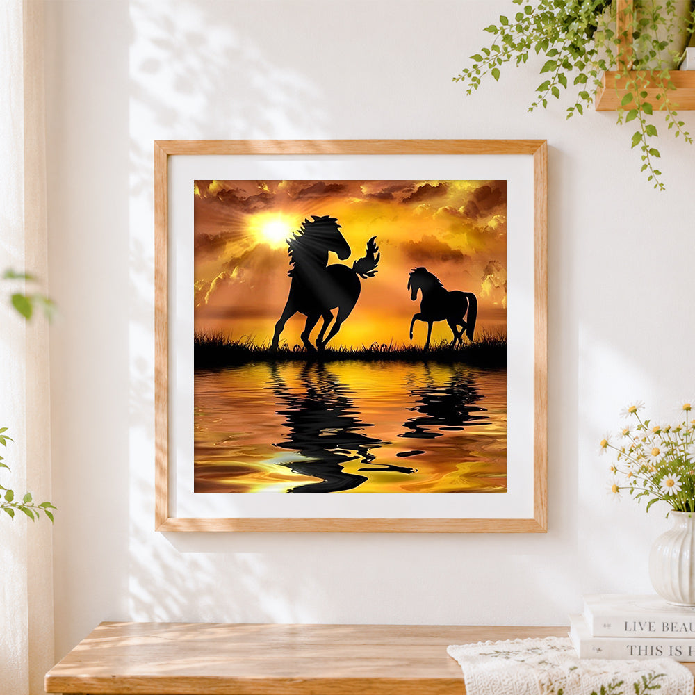 Finished horse silhouettes at sunset cross stitch artwork displayed
