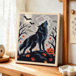 Howling wolf on halloween night punch needle artwork displayed on a table