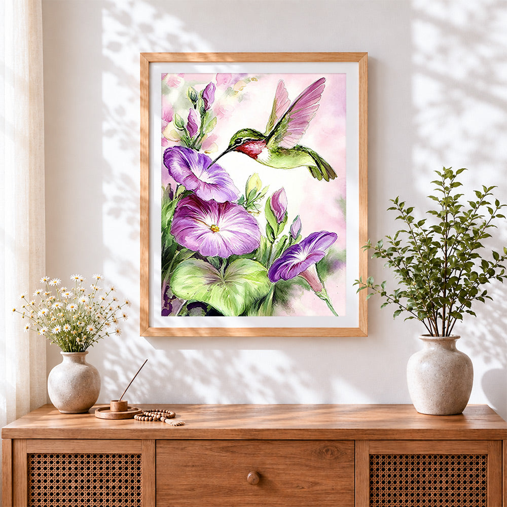 Finished hummingbird and morning glory cross stitch artwork displayed
