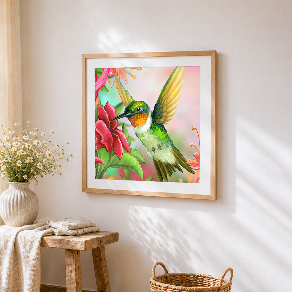 Hummingbird and pink flower cross stitch artwork displayed on wall as home decor