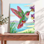 Finished hummingbird and wildflowers pearl diamond painting artwork displayed as home decor