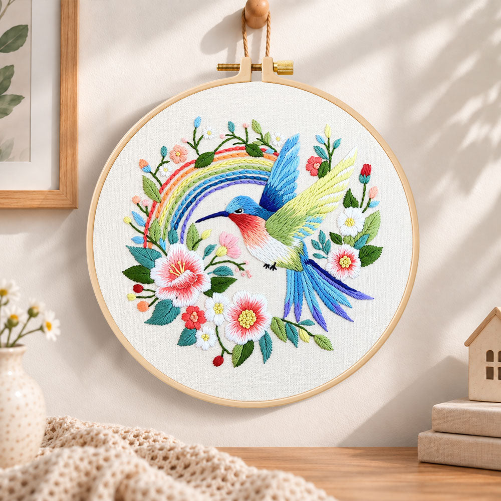 Hummingbird with rainbow embroidery hoop wall art displayed as warm and cosy handmade home decor