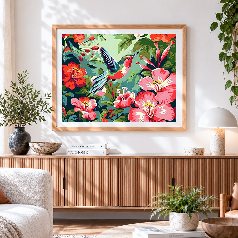 Finished hummingbird with tropical hibiscus flowers cross stitch artwork displayed