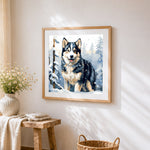 Husky in a snowy forest cross stitch artwork displayed on wall as home decor