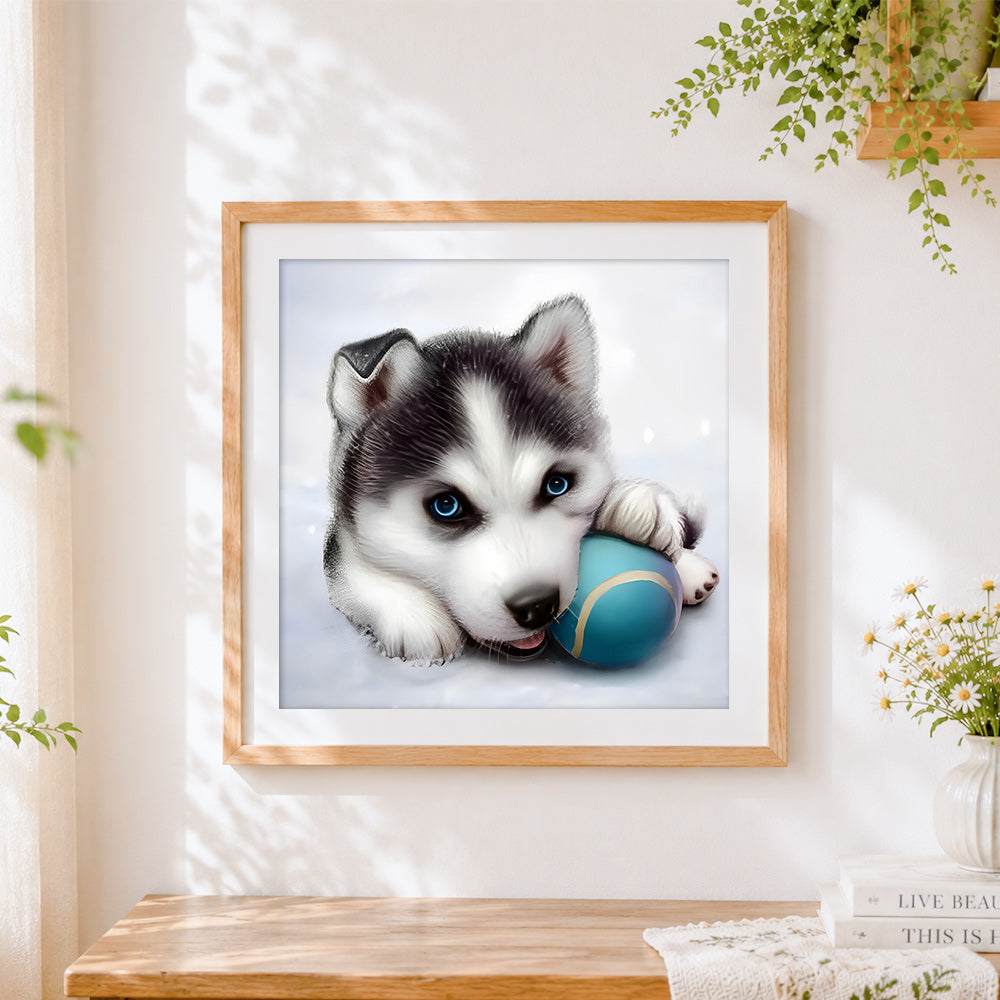 Finished husky puppy with a ball cross stitch artwork displayed