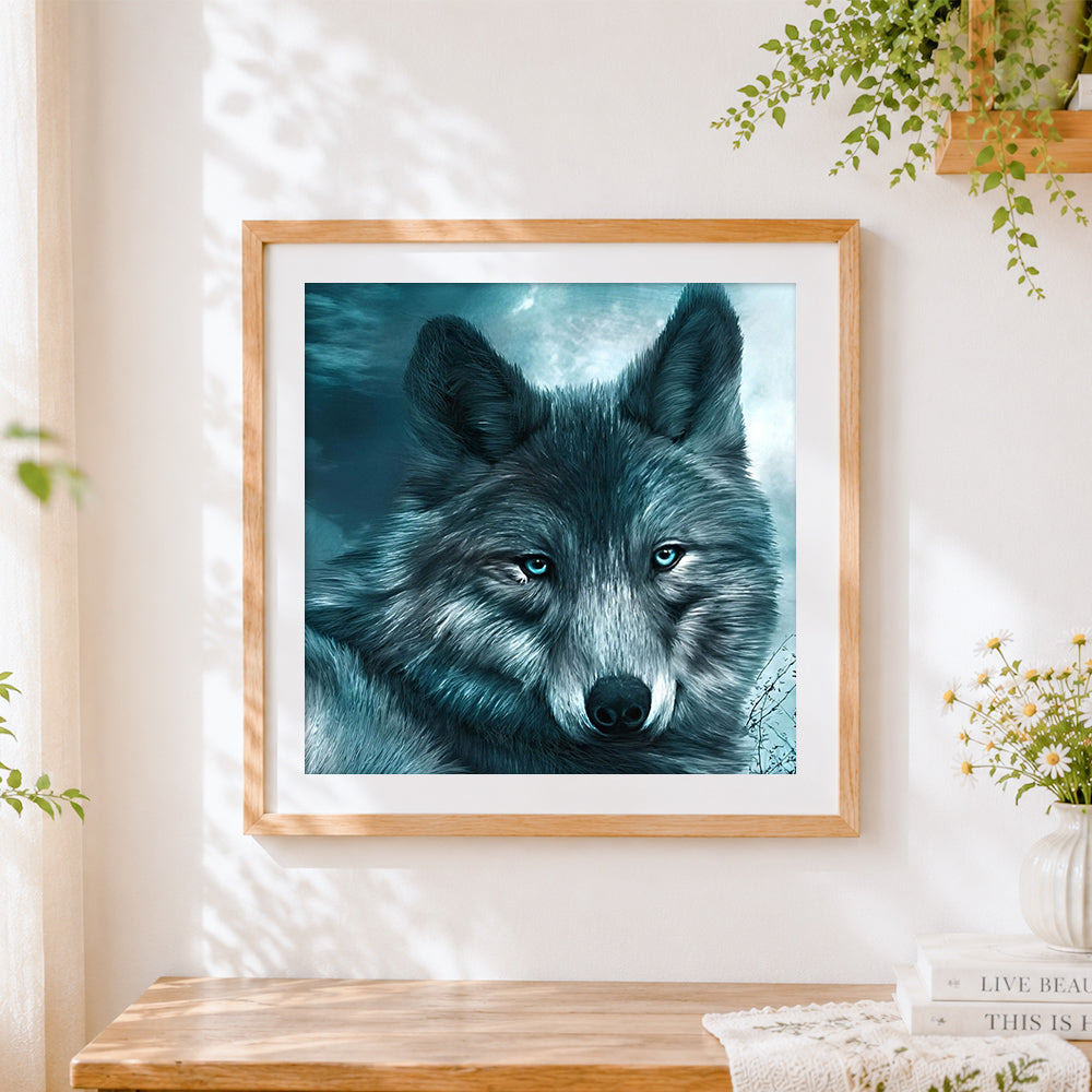 Finished ice blue eyed wolf portrait cross stitch artwork displayed
