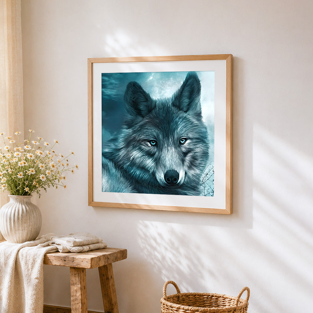 Ice blue eyed wolf portrait cross stitch artwork displayed on wall as home decor