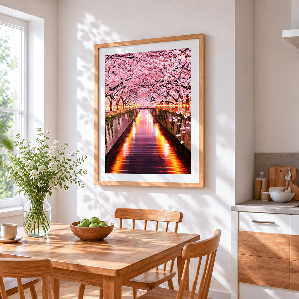 Illuminated cherry blossom tunnel cross stitch artwork displayed on wall as home decor