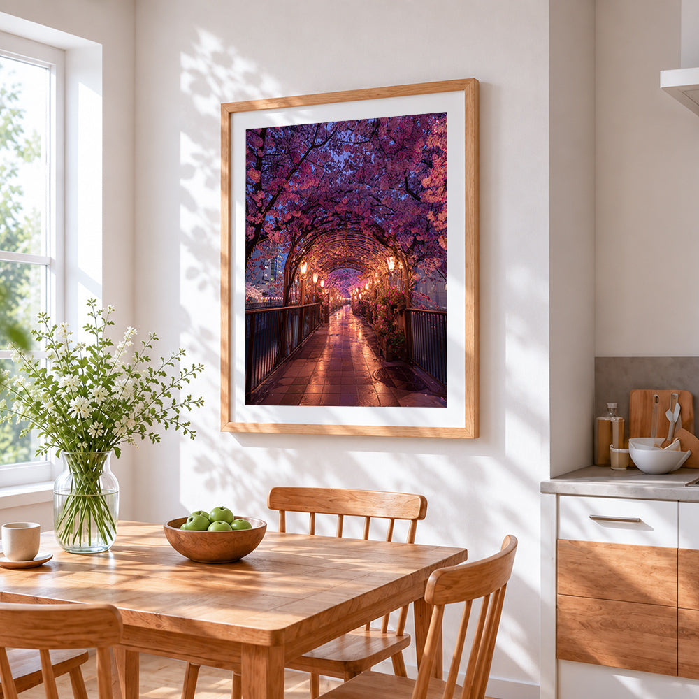 Illuminated cherry blossom walkway cross stitch artwork displayed on wall as home decor