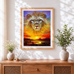 Finished impasto lion and sunset cross stitch artwork displayed