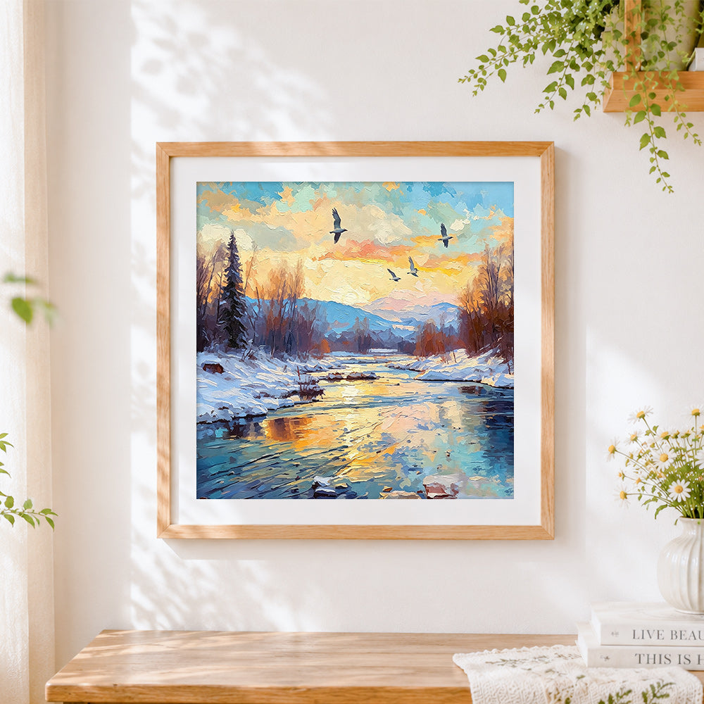 Finished impasto sunset over a snowy river cross stitch artwork displayed