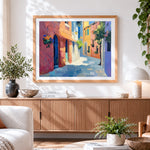 Finished impressionist architecture cross stitch artwork displayed