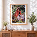 Finished impressionist girl in red hood with flowers cross stitch artwork displayed