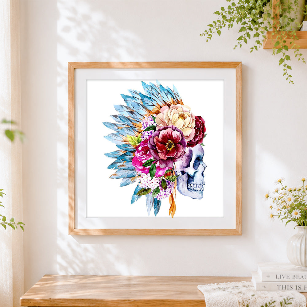 Finished indian feather and flower skull cross stitch artwork displayed