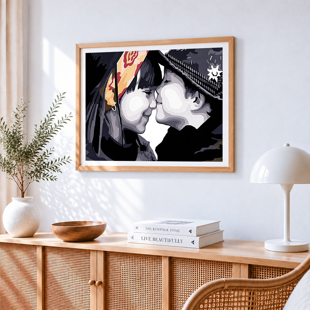 Innocent childhood kiss cross stitch artwork displayed on wall as home decor