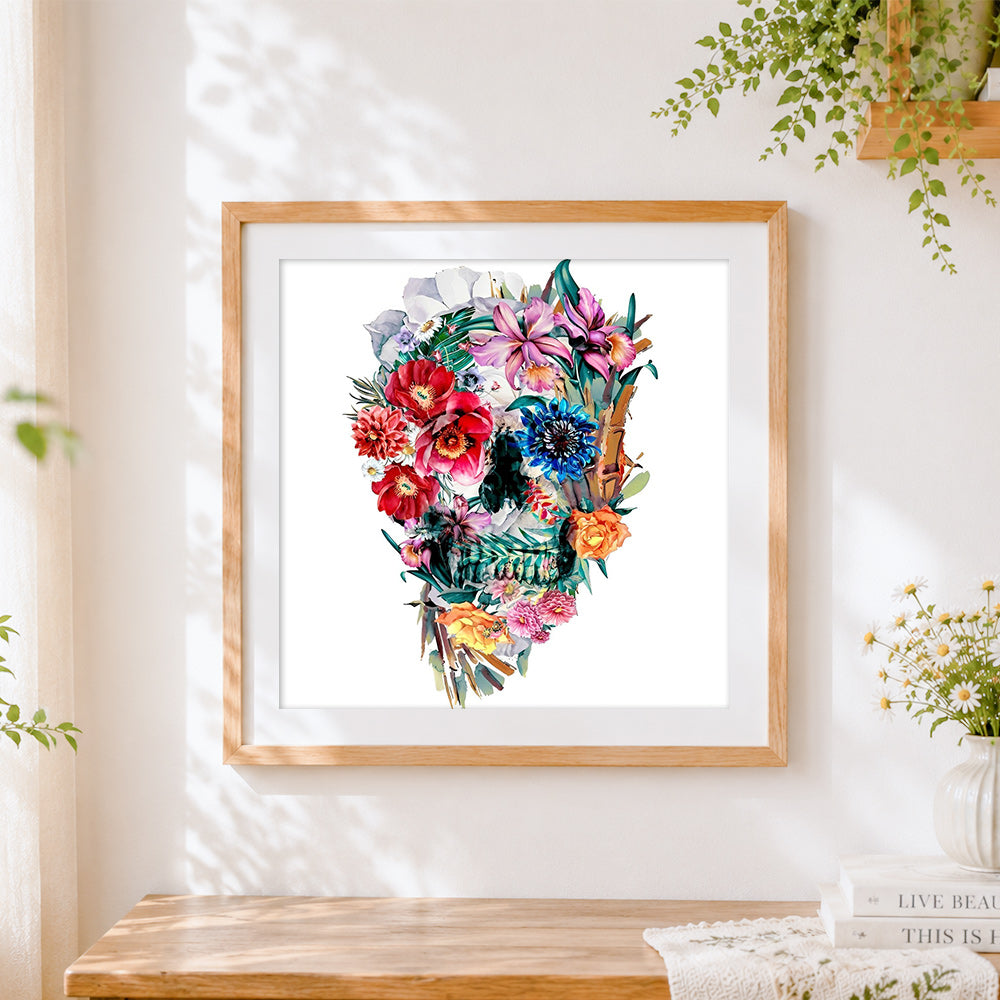 Finished intricate watercolour floral skull cross stitch artwork displayed