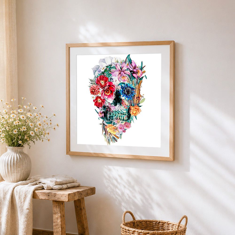 Intricate watercolour floral skull cross stitch artwork displayed on wall as home decor
