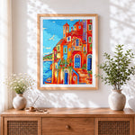 Finished italian coastal village cross stitch artwork displayed