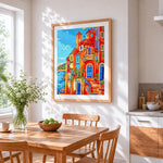 Italian coastal village cross stitch artwork displayed on wall as home decor