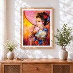 Finished japanese geisha with pink parasol cross stitch artwork displayed