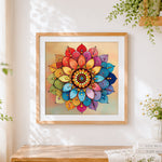 Finished jewelled colourful mandala cross stitch artwork displayed