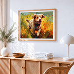 Joyful spaniel running through wildflowers cross stitch artwork displayed on wall as home decor