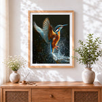 Finished kingfisher bird diving cross stitch artwork displayed