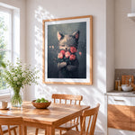 Kitten hugging pink roses cross stitch artwork displayed on wall as home decor