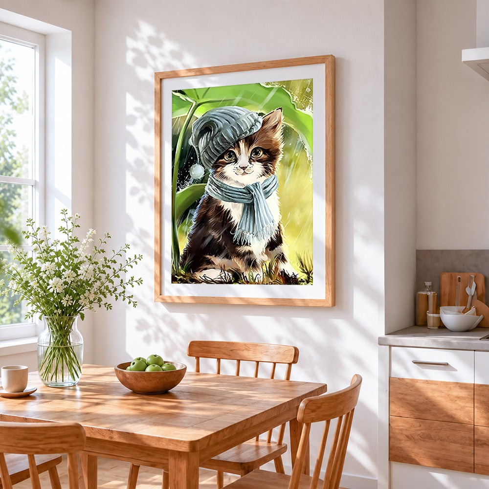 Kitten in winter hat and scarf cross stitch artwork displayed on wall as home decor