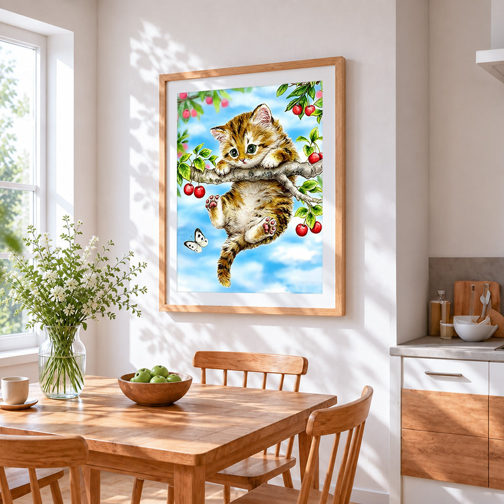 Kitten on cherry tree cross stitch artwork displayed on wall as home decor