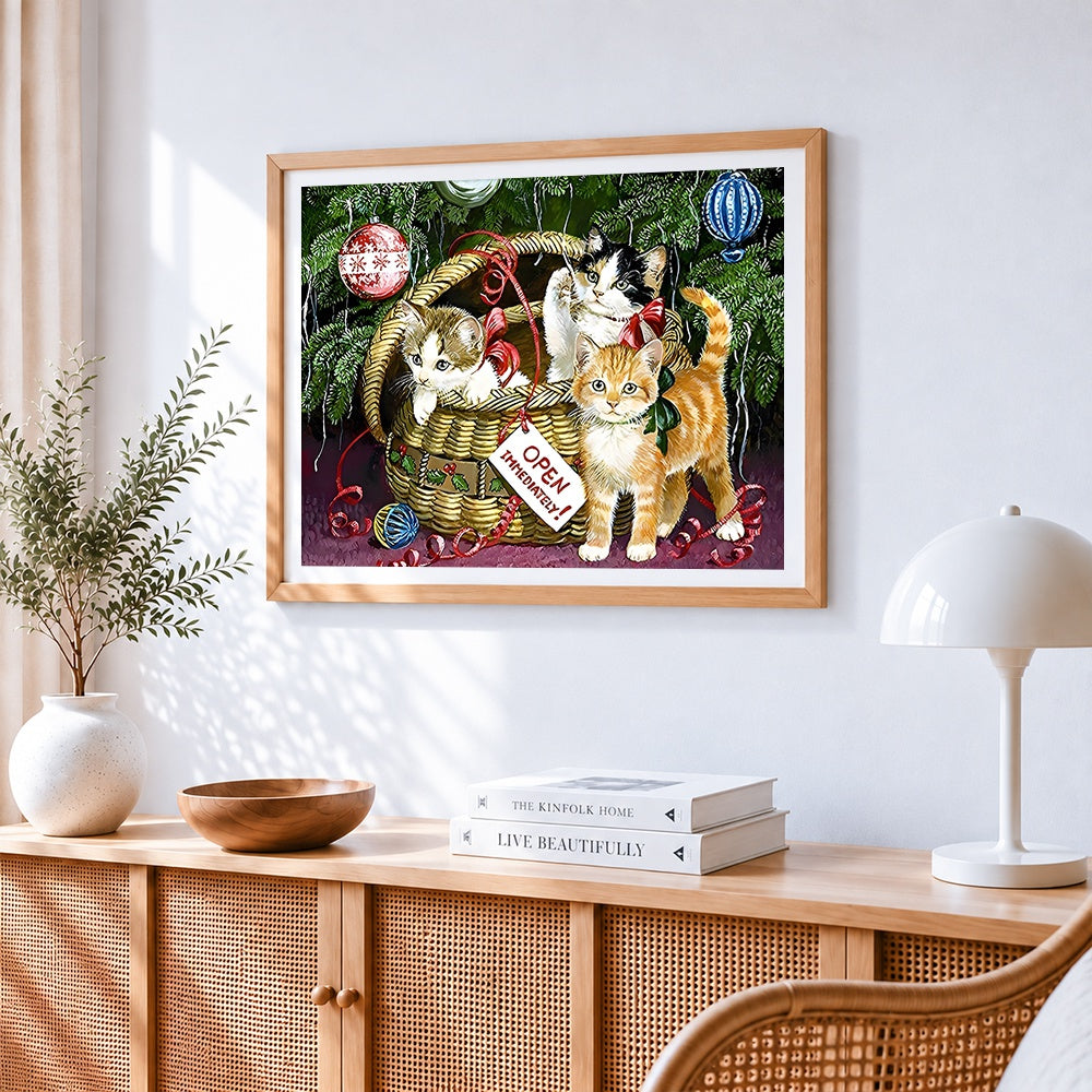 Kittens in a basket by the christmas tree cross stitch artwork displayed on wall as home decor