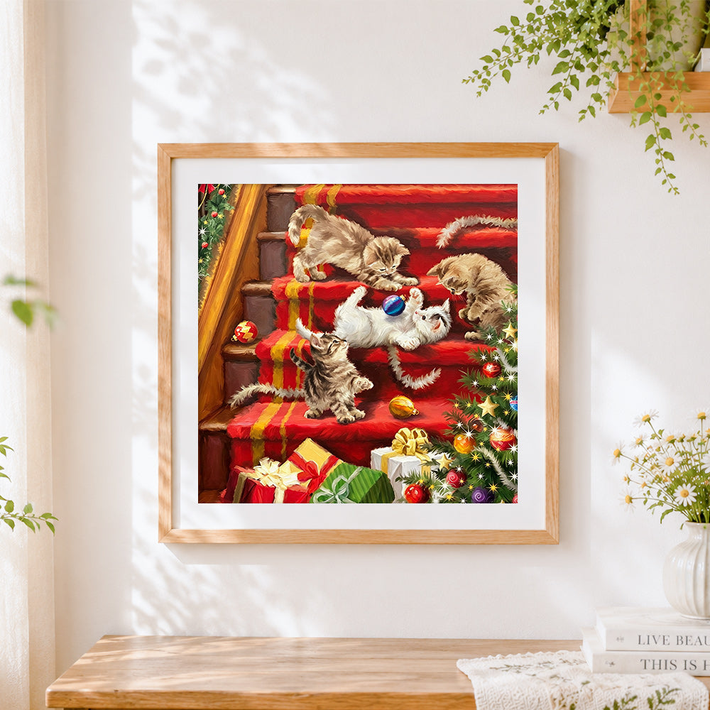Finished kittens playing on red stairs cross stitch artwork displayed