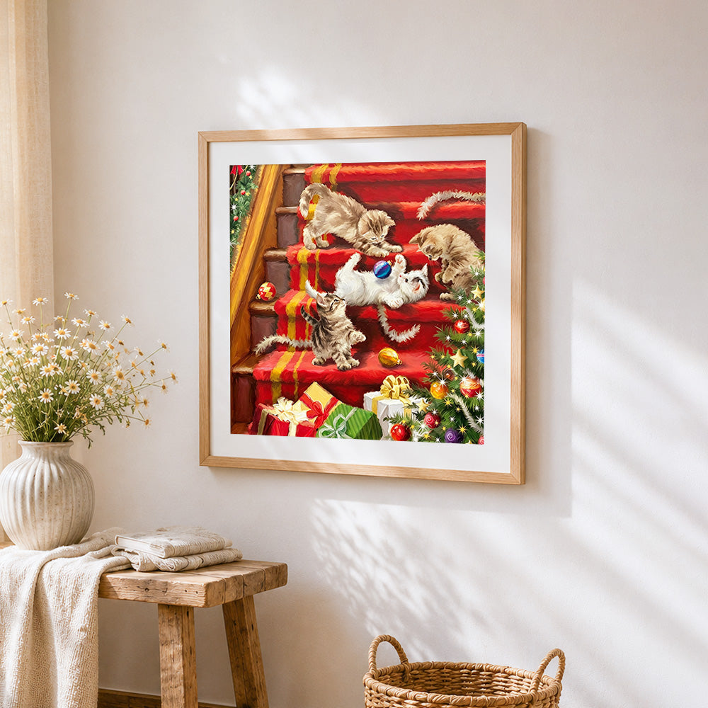 Kittens playing on red stairs cross stitch artwork displayed on wall as home decor