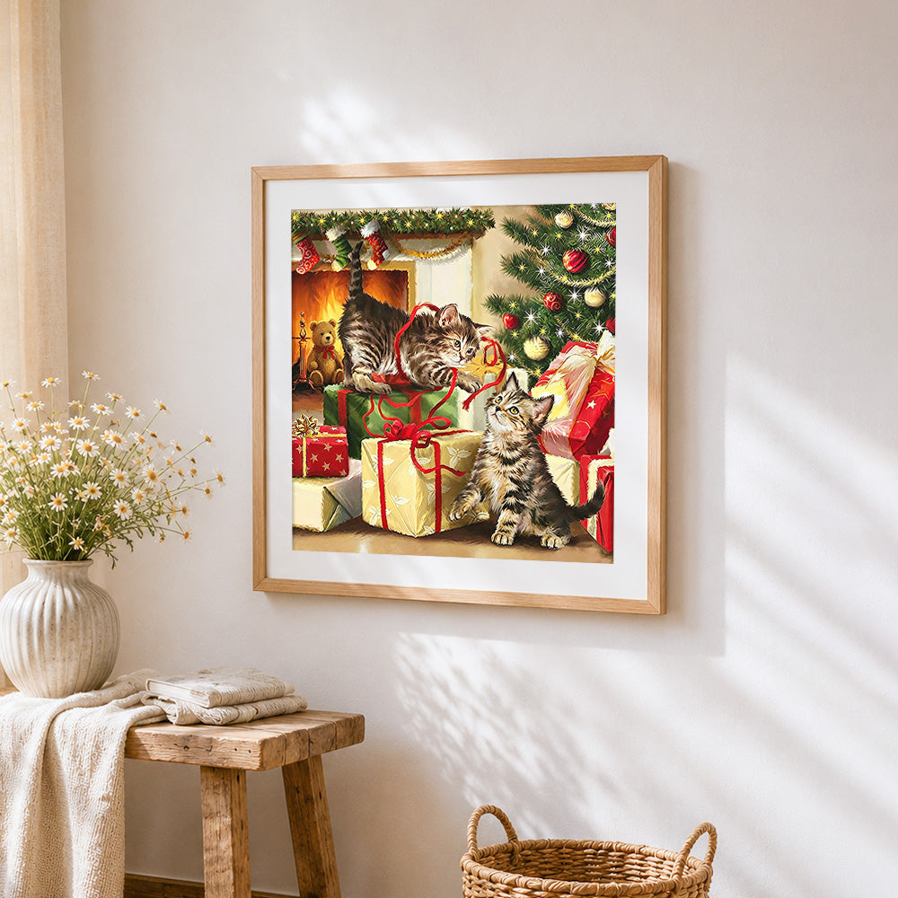 Kittens playing with gifts by the tree paint by numbers artwork displayed on wall as home decor