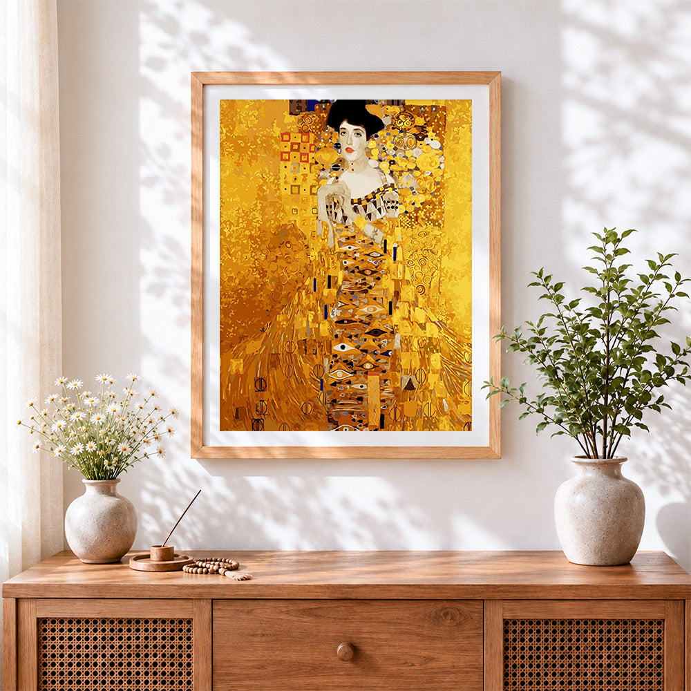 Finished klimt style golden portrait cross stitch artwork displayed