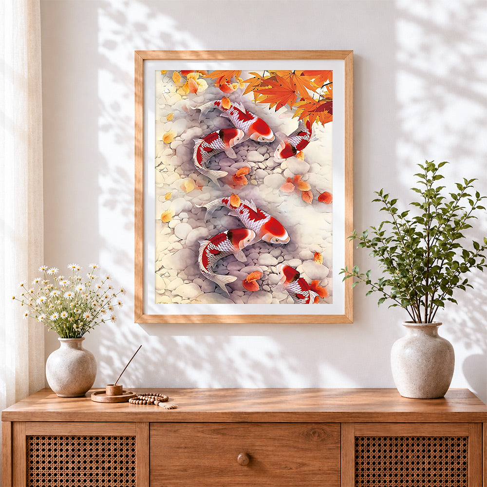Finished koi fish and autumn leaves cross stitch artwork displayed