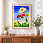 Finished ladybirds and daisy flower cross stitch artwork displayed