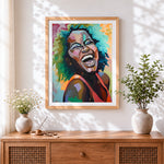Finished laughing woman with colourful hair cross stitch artwork displayed