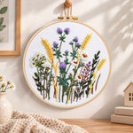 Lavender and wheat bouquet embroidery hoop wall art displayed as warm and cosy handmade home decor