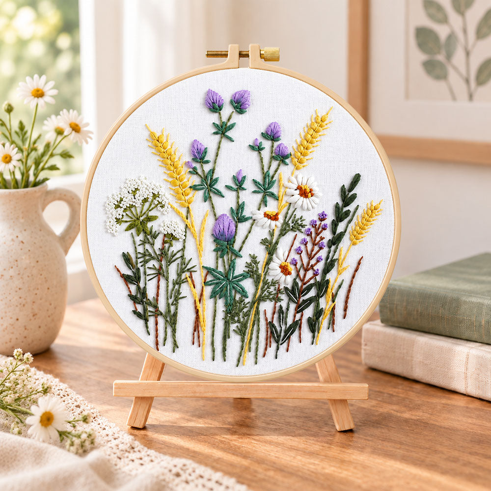 Lavender and wheat bouquet embroidery kit finished hoop displayed on a wooden stand as cosy tabletop decor