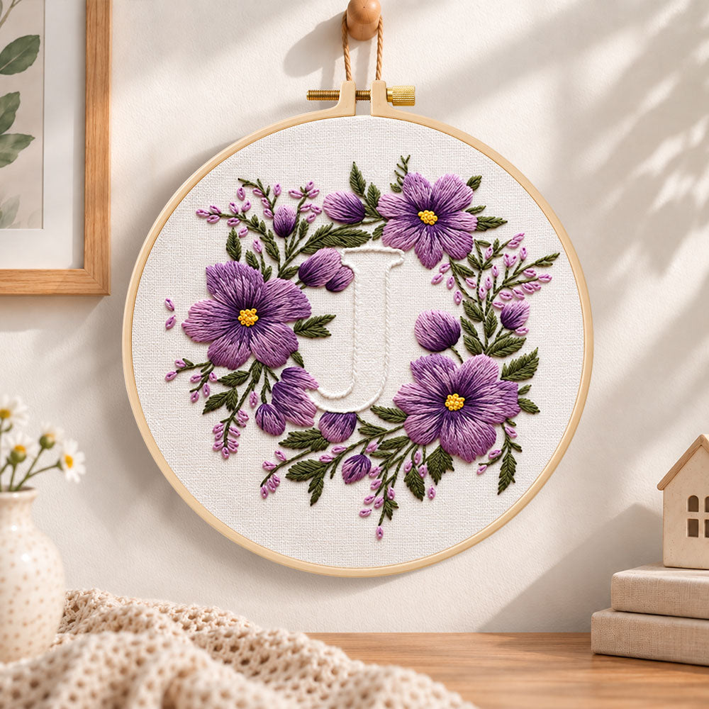 Lavender purple wreath and letter j embroidery hoop wall art displayed as warm and cosy handmade home decor