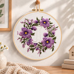 Lavender purple wreath and letter j embroidery hoop wall art displayed as warm and cosy handmade home decor