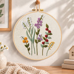 Lavender wildflower embroidery hoop wall art displayed as warm and cozy handmade home decor