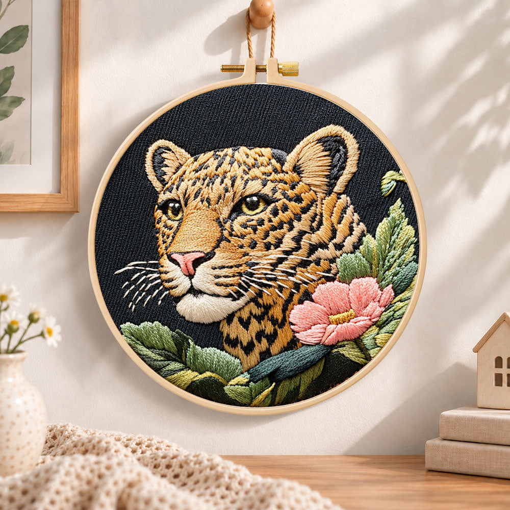 Leopard and pink wildflower embroidery hoop wall art displayed as warm and cosy handmade home decor